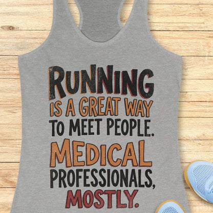 Gray tank top with humorous text on a wooden surface