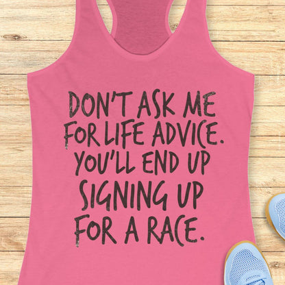 A pink racerback tank top with black hand-drawn text reading 'DON'T ASK ME FOR LIFE ADVICE. YOU'LL END UP SIGNING UP FOR A RACE.