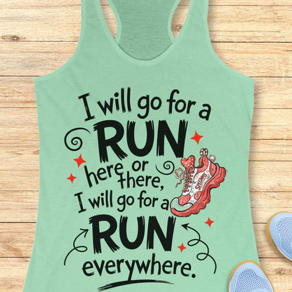 A mint racerback tank top laid flat on a light wood plank background, featuring a motivational quote in black script and bold block lettering that reads, 'I will go for a RUN here or there, I will go for a RUN everywhere.' with a red running shoe illustration and small red star accents.