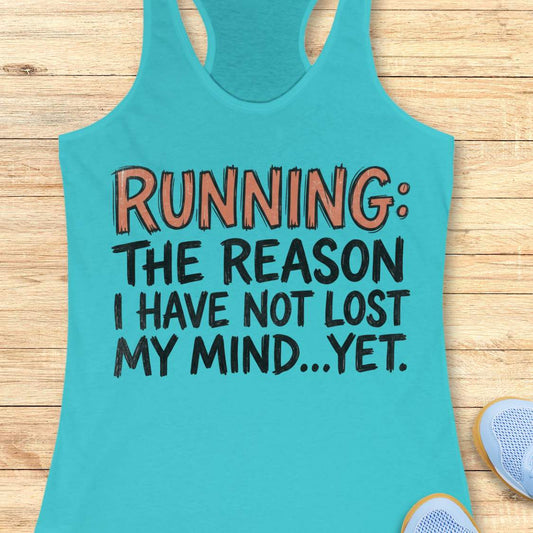 A turquoise racerback tank top laid flat on a light wood surface, printed with the phrase 'RUNNING: THE REASON I HAVE NOT LOST MY MIND.