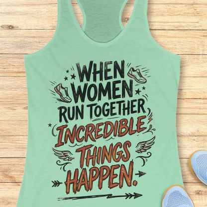 A mint green racerback tank top with a motivational graphic that reads 'WHEN WOMEN RUN TOGETHER INCREDIBLE THINGS HAPPEN.' in black and reddish-brown lettering, styled flat on a light wood background with partial sneakers visible at the edges.