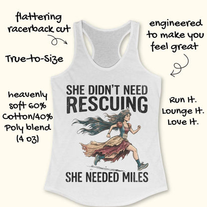 A white racerback tank top laid flat on a light wood background, featuring a graphic of a marathon runner with the text 'SHE DIDN'T NEED RESCuing SHE NEEDED MILES'. Partial blue shoes are visible at the bottom right.