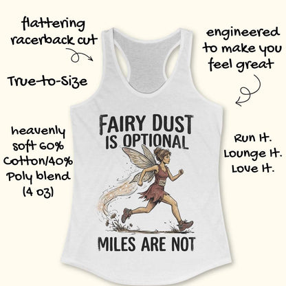 A white racerback tank top laid flat on a light wood background, featuring a graphic of a running fairy and the text 'FAIRY DUST IS OPTIONAL MILES ARE NOT'. Partial blue shoes are visible at the bottom right as styling props.