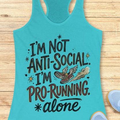A turquoise racerback tank top laid flat on a light wood surface, printed with the phrase “I’m Not Anti-Social. I’m Pro-Running.