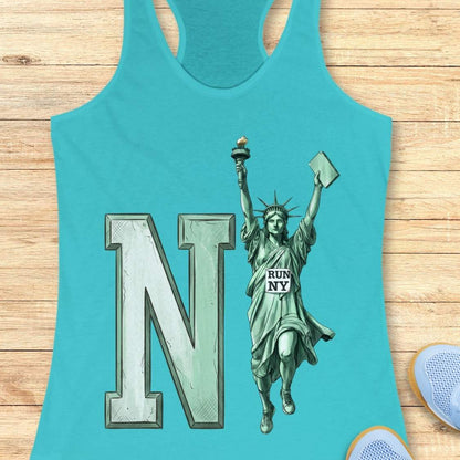 A turquoise racerback tank top laid flat on a light wood surface, featuring a large letter N and a Statue of Liberty graphic with a small sign that reads 'RUN NY'.