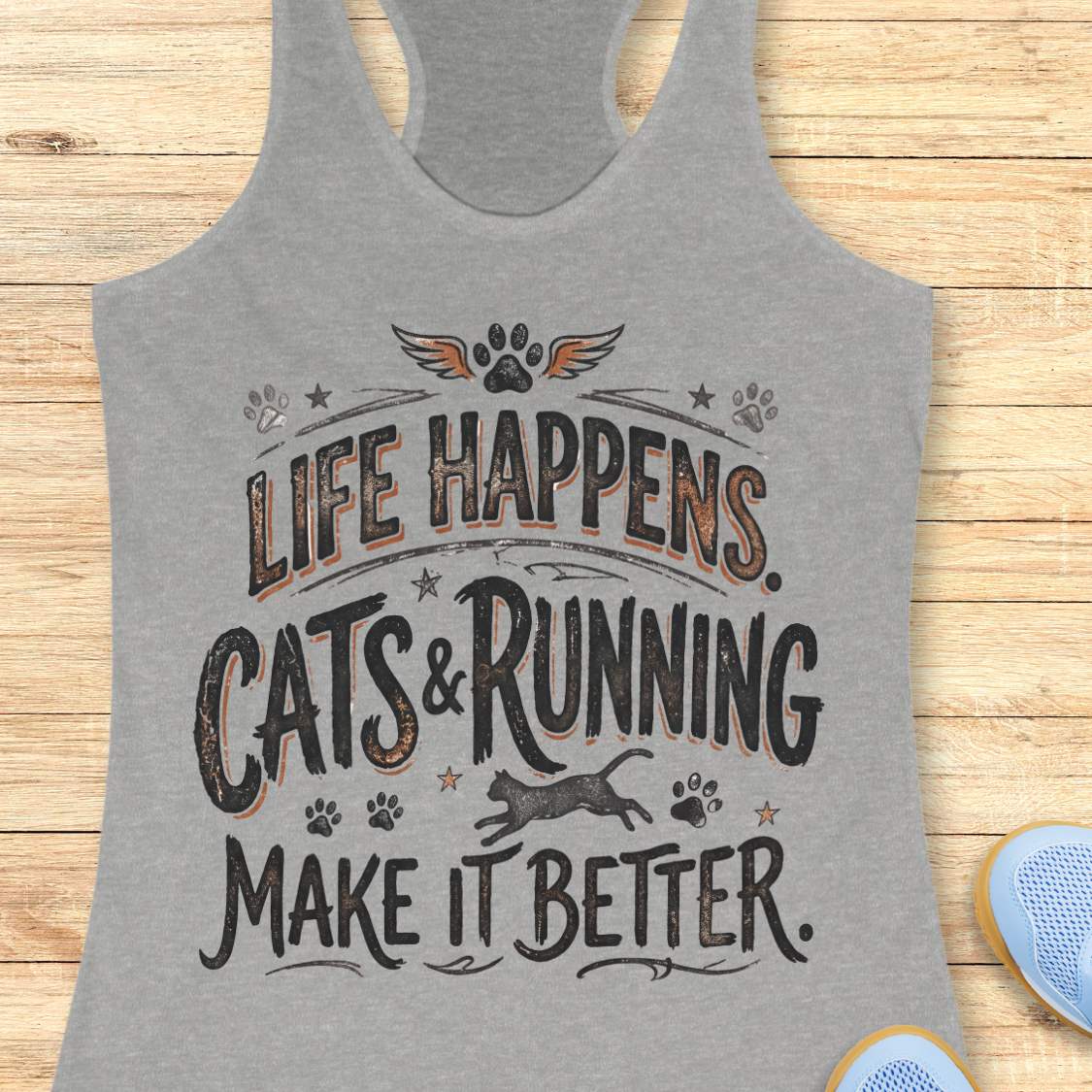 A heather gray racerback tank top with a distressed graphic that reads 'LIFE HAPPENS. CATS & RUNNING MAKE IT BETTER.