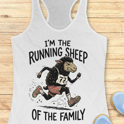 A white racerback tank top laid flat on a light wood background, featuring a cartoon running sheep graphic with the text 'I'M THE RUNNING SHEEP OF THE FAMILY' and the number 77.