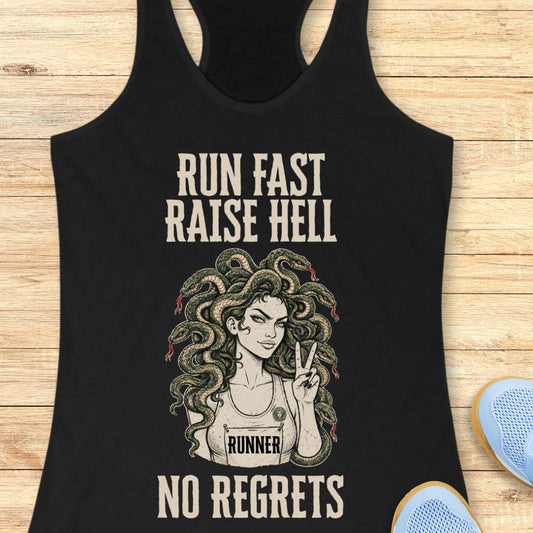 Black racerback tank top for women displayed on a light wood background. The design features bold vintage-style text reading “RUN FAST RAISE HELL” at the top and “NO REGRETS” at the bottom. In the center is an illustration of a runner with Medusa-inspired snake hair, wearing a race bib labeled “RUNNER” and holding up a peace sign. Partial running shoes are visible in the lower corners of the image.
