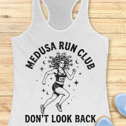 white women's running tank top featuring a Medusa runner with snake hair, race bib 128, stars, and moons. Text reads "MEDUSA RUN CLUB" and "DON'T LOOK BACK." Mythology-inspired running apparel for women runners, featuring an empowering Greek mythology fitness design.