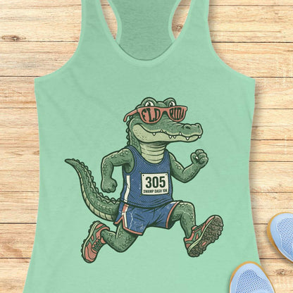 Funny Florida runner mint tank top featuring a cartoon alligator wearing running gear, race bib 305, and Florida sunglasses while running. Perfect apparel for Florida runners, women runners, marathon training, trail runners, swamp runners, and anyone who loves running in the heat and humidity.