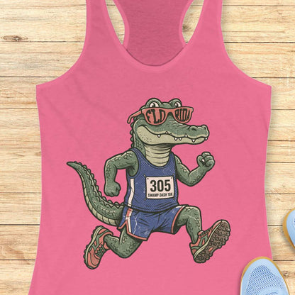 Funny Florida runner pink tank top featuring a cartoon alligator wearing running gear, race bib 305, and Florida sunglasses while running. Perfect apparel for Florida runners, women runners, marathon training, trail runners, swamp runners, and anyone who loves running in the heat and humidity.