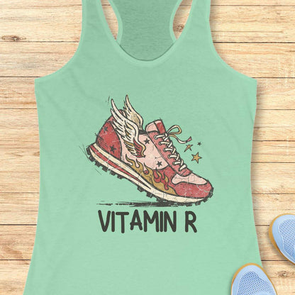 Funny women’s running mint tank top featuring a vintage winged running shoe with flames and the slogan “Vitamin R.” A playful design for runners, marathon runners, half marathon runners, trail runners, and women who consider running their favorite form of therapy and energy.