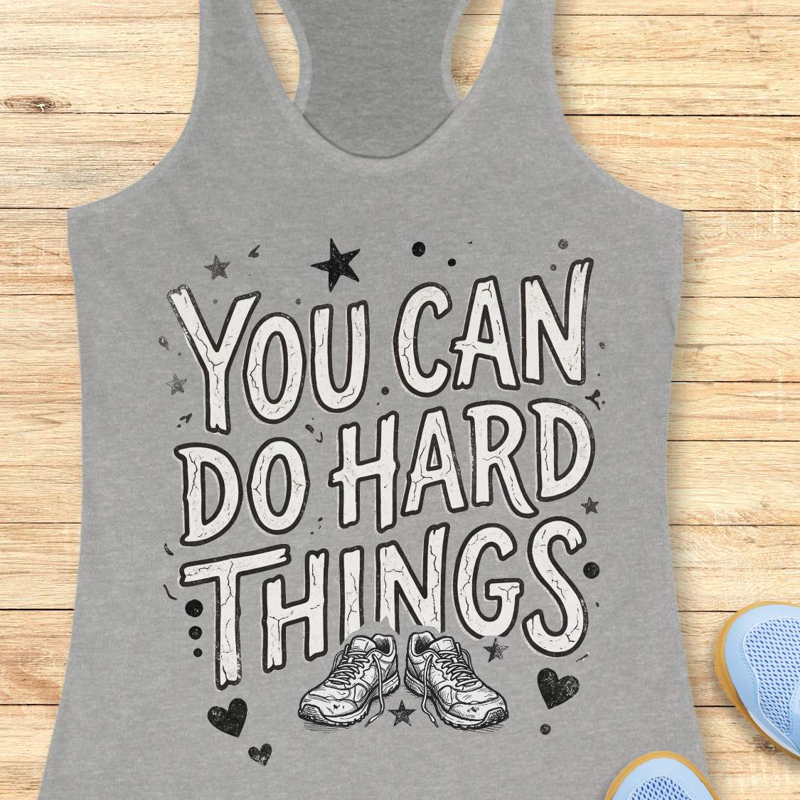 Motivational running grey racebak tank top featuring the quote “You Can Do Hard Things” with running shoes, stars, and hearts on a black women's racerback tank, inspirational gift for runners, marathon runners, and fitness lovers.