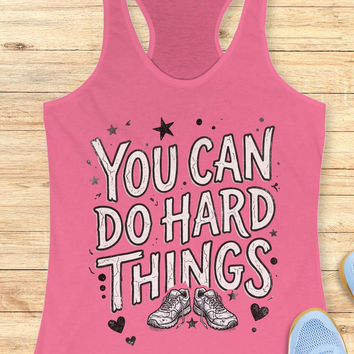 Motivational running pink racebak tank top featuring the quote “You Can Do Hard Things” with running shoes, stars, and hearts on a black women's racerback tank, inspirational gift for runners, marathon runners, and fitness lovers.