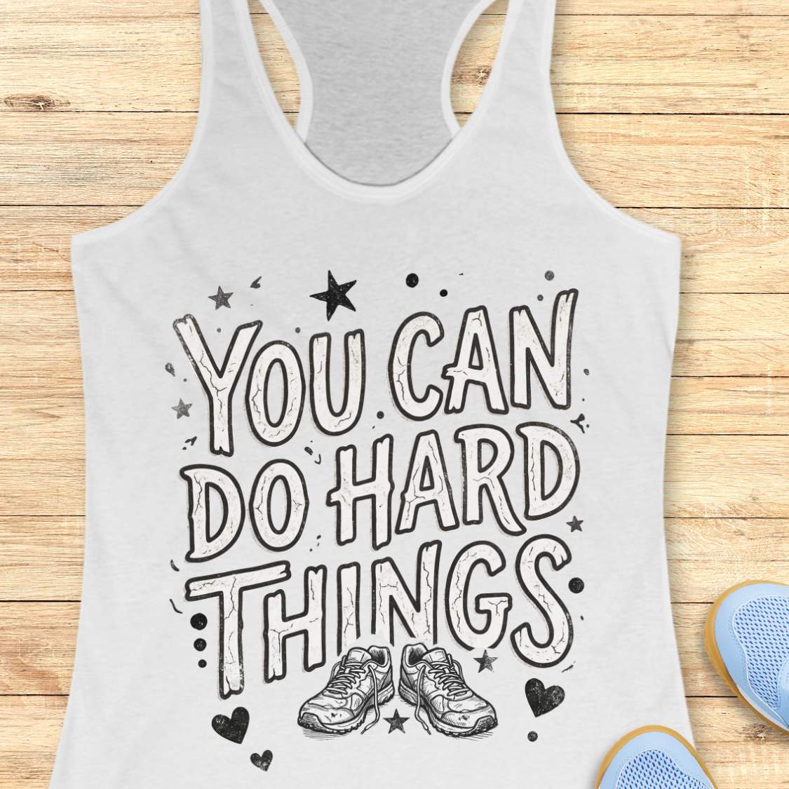 Motivational running white racebak tank top featuring the quote “You Can Do Hard Things” with running shoes, stars, and hearts on a black women's racerback tank, inspirational gift for runners, marathon runners, and fitness lovers.