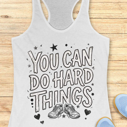 Motivational running white racebak tank top featuring the quote “You Can Do Hard Things” with running shoes, stars, and hearts on a black women's racerback tank, inspirational gift for runners, marathon runners, and fitness lovers.