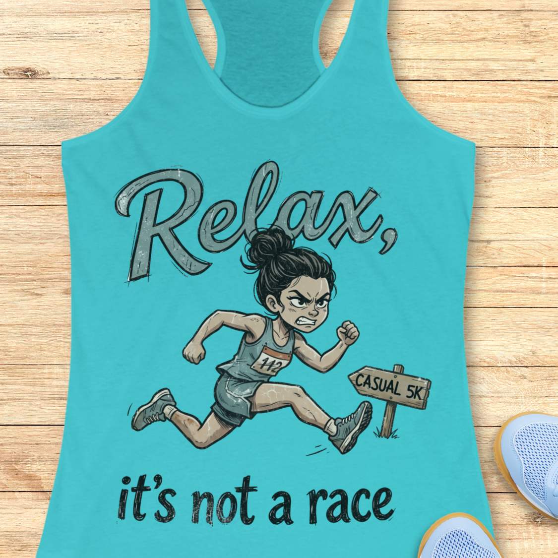 Funny women's running blue tank top featuring a cartoon runner sprinting intensely during a casual 5K race with the phrase "Relax, it's not a race." The design shows a determined runner wearing a race bib charging past a sign labeled "Casual 5K," creating a humorous contrast between a relaxed fun run and competitive running behavior. Perfect for women runners, race enthusiasts, 5K participants, running club members, and anyone who takes recreational races a little too seriously. 