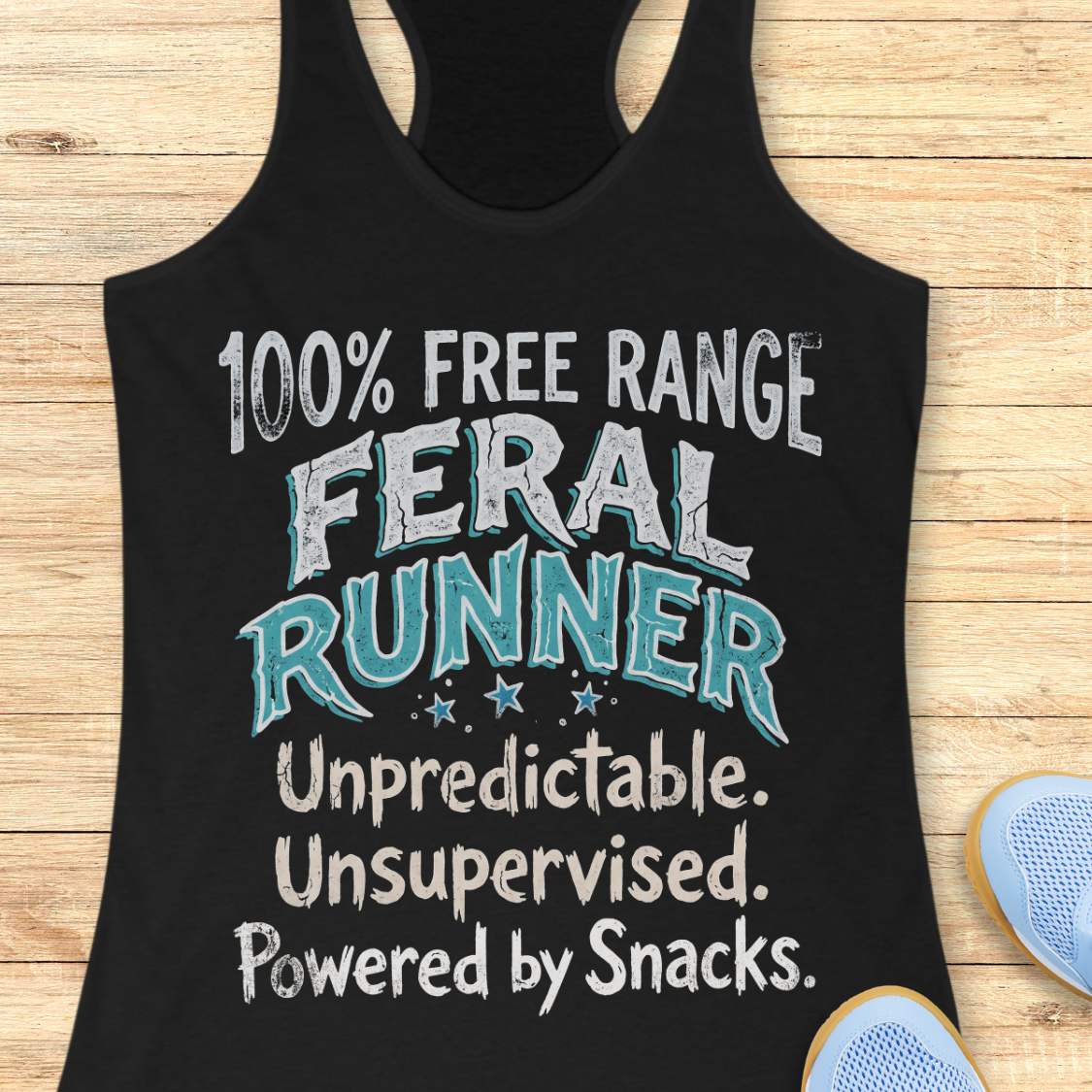 Funny women's running tank top featuring the bold phrase "100% FREE RANGE FERAL RUNNER" with the humorous personality traits "Unpredictable. Unsupervised. Powered by Snacks." displayed in distressed vintage-style typography on a black racerback tank. This playful running design celebrates free-spirited runners who embrace adventure, independence, and a love of post-run treats. Perfect for women runners, trail runners, marathon runners, half marathon participants, 5K runners, running club members, and 