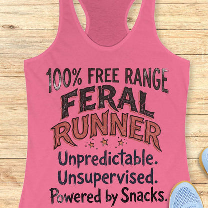 Funny women's running tank top featuring the bold phrase "100% FREE RANGE FERAL RUNNER" with the humorous personality traits "Unpredictable. Unsupervised. Powered by Snacks." displayed in distressed vintage-style typography on a pink racerback tank. This playful running design celebrates free-spirited runners who embrace adventure, independence, and a love of post-run treats. Perfect for women runners, trail runners, marathon runners, half marathon participants, 5K runners, running club members, and 