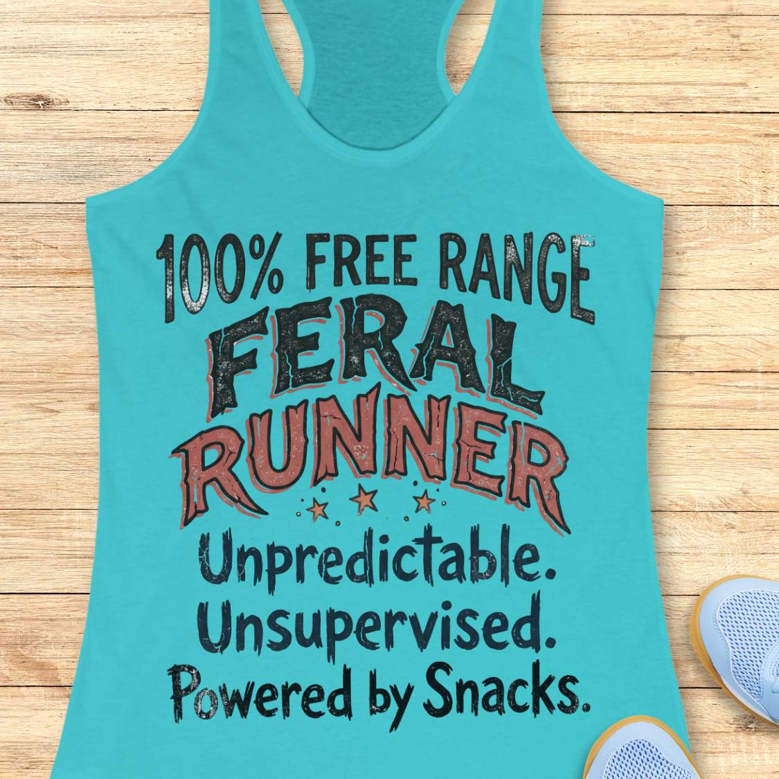 Funny women's running tank top featuring the bold phrase "100% FREE RANGE FERAL RUNNER" with the humorous personality traits "Unpredictable. Unsupervised. Powered by Snacks." displayed in distressed vintage-style typography on a bright blue racerback tank. This playful running design celebrates free-spirited runners who embrace adventure, independence, and a love of post-run treats. Perfect for women runners, trail runners, marathon runners, half marathon participants, 5K runners, running club members, and 