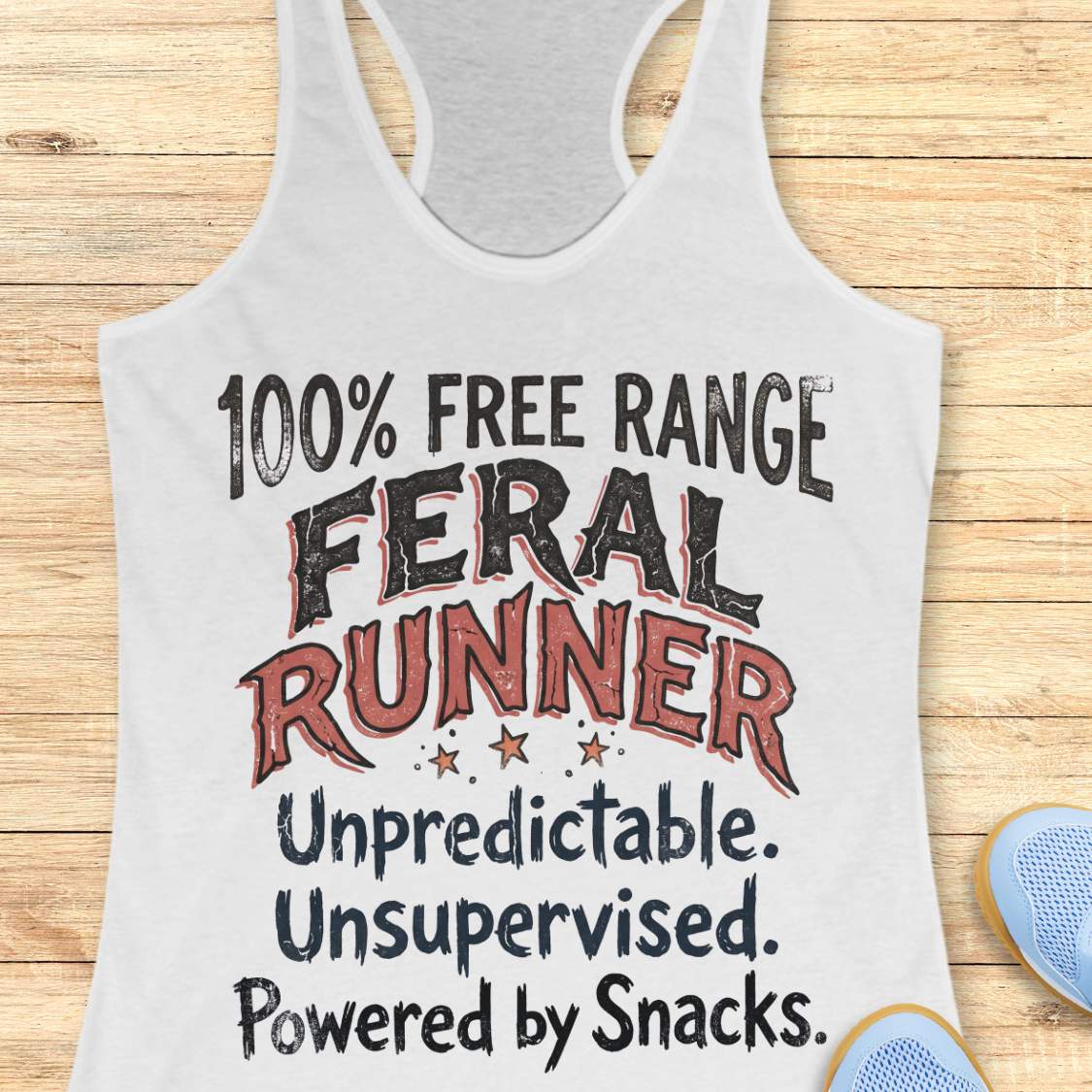 Funny women's running tank top featuring the bold phrase "100% FREE RANGE FERAL RUNNER" with the humorous personality traits "Unpredictable. Unsupervised. Powered by Snacks." displayed in distressed vintage-style typography on a white racerback tank. This playful running design celebrates free-spirited runners who embrace adventure, independence, and a love of post-run treats. Perfect for women runners, trail runners, marathon runners, half marathon participants, 5K runners, running club members, and 