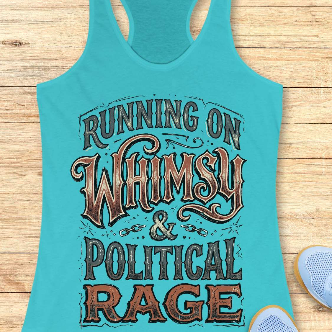 women's blue racerback running tank top featuring the whimsical slogan "Running On Whimsy & Political Rage" in ornate vintage-inspired typography. Humorous running apparel for women who embrace both lighthearted fun and passionate determination. Unique statement tank for female runners, marathon runners, trail runners, and fitness enthusiasts who combine a love of running, humor, and strong convictions. Displayed on a wooden background with running shoes, highlighting a bold and artistic design perfect for