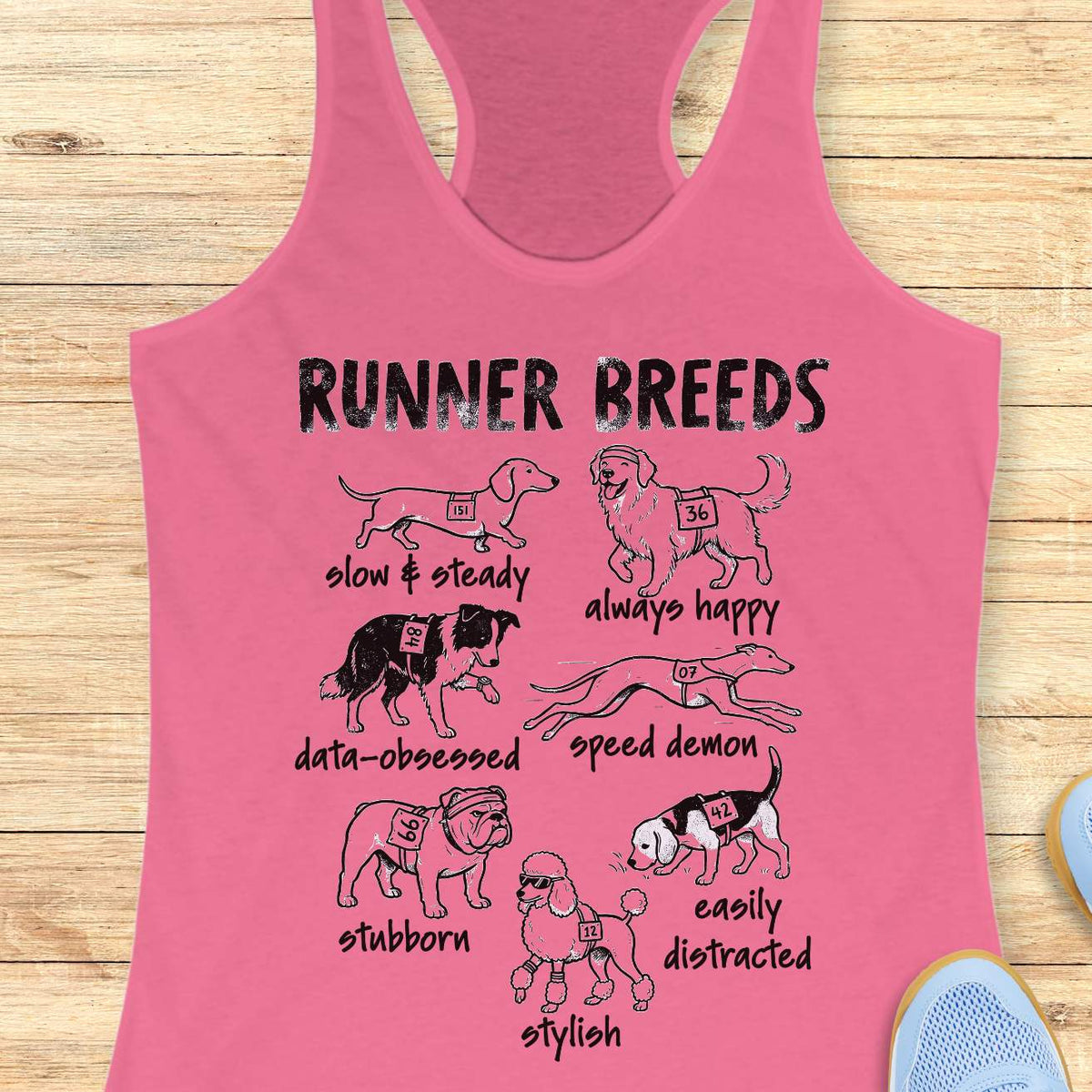 Funny Runner Breeds pink tank top featuring dog breed runner personalities including Slow & Steady Dachshund, Always Happy Golden Retriever, Data-Obsessed Border Collie, Speed Demon Greyhound, Stubborn Bulldog, Easily Distracted Beagle, and Stylish Poodle. Humorous running apparel for women runners, marathon runners, half marathon participants, dog lovers, race enthusiasts, and fitness fans. Graphic running tank with race bib dogs and runner humor illustration.