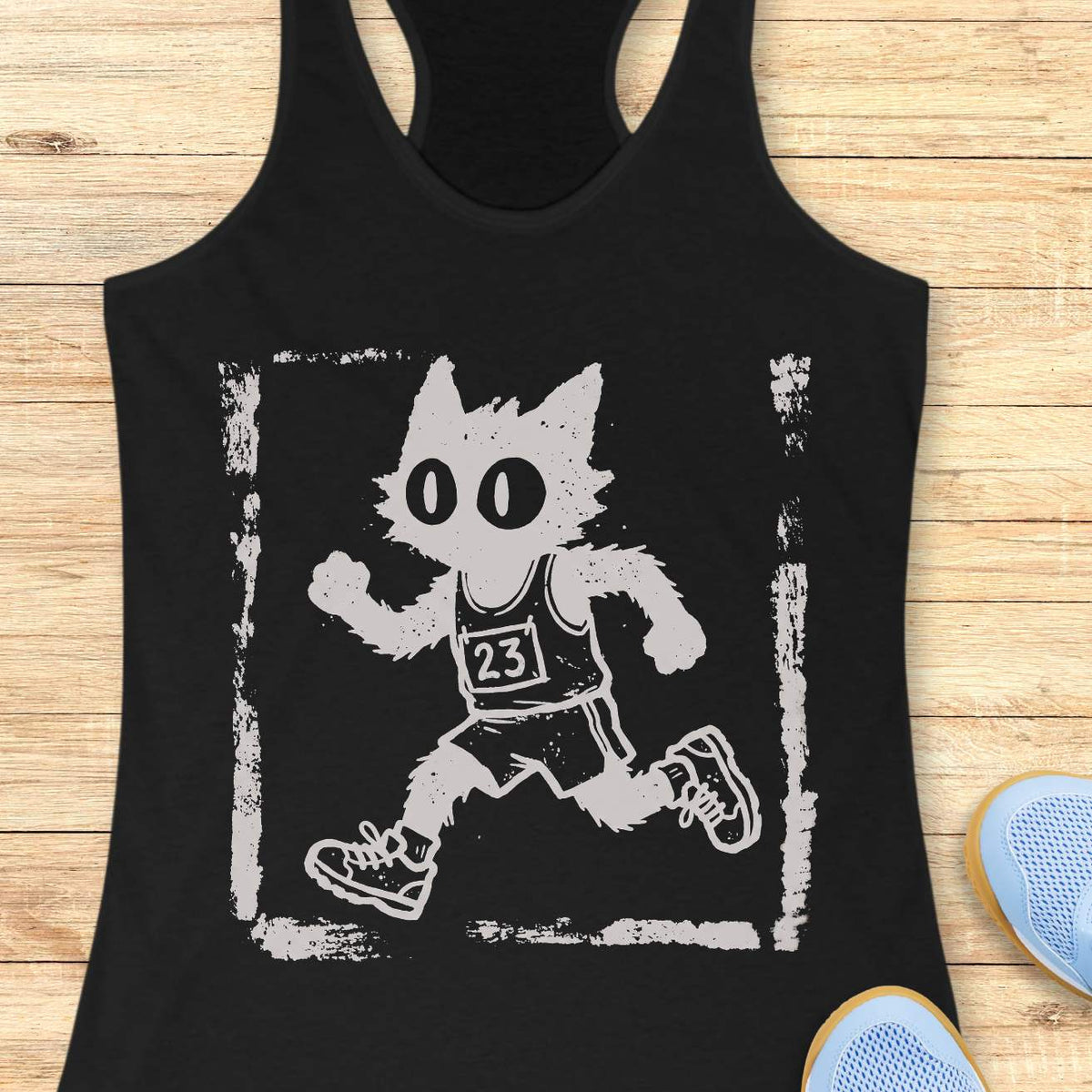 Women's black racerback tank top with a retro distressed running cat graphic. The design showcases a quirky black cartoon cat with oversized eyes sprinting in running gear, including a race bib marked 23, shorts, and sneakers. Rendered in a vintage hand-drawn illustration style with grunge screen-print textures and a weathered border, the artwork blends running culture with cat lover humor. Ideal apparel for women who enjoy running, marathon training, race day events, jogging, trail running, fitness, and f