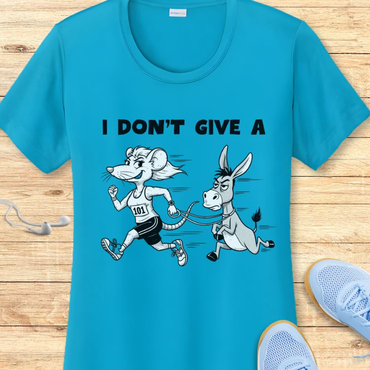 A bright turquoise t-shirt featuring the phrase I DON'T GIVE A above a cartoon graphic of a smiling white mouse runner with bib 101 pulling a grumpy gray donkey on a leash, displayed on a light wooden background with blue sneakers and white earbuds