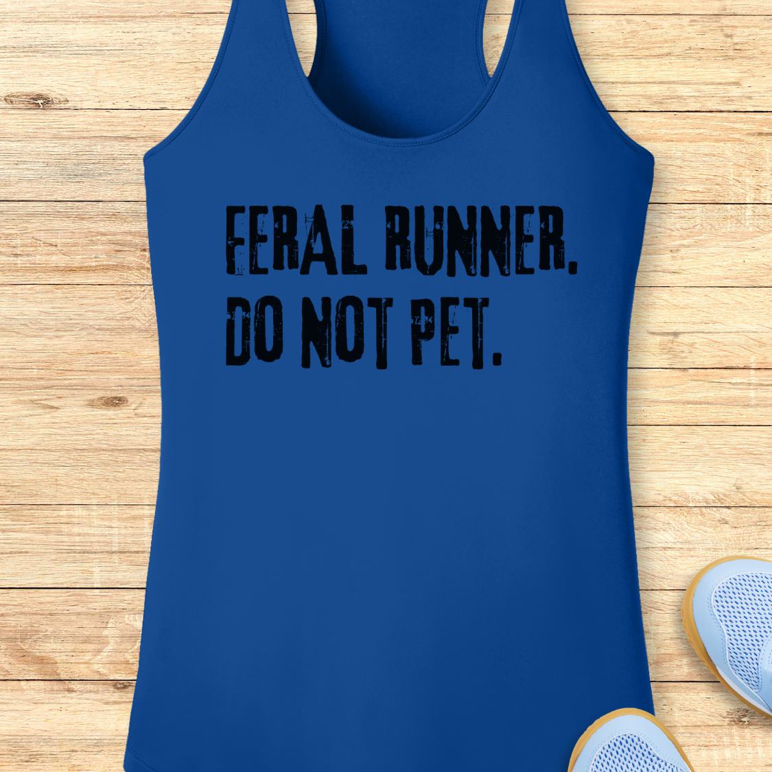 A royal blue performance  racerback tank top with the text 'FERAL RUNNER. DO NOT PET.