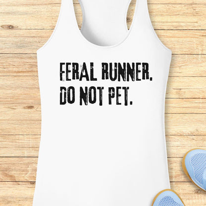 White racerback performance  tank top with distressed black text reading 'FERAL RUNNER. DO NOT PET.