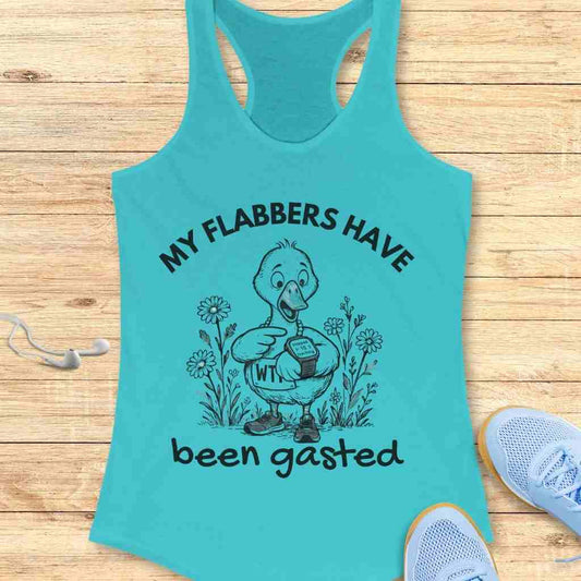 Graphic print on a teal racerback tank top depicting a surprised cartoon duck wearing sneakers and pointing to a smartwatch displaying 'Stopped 1:15 Walking' surrounded by wildflowers with the humorous text 'MY FLABBERS HAVE been gasted'