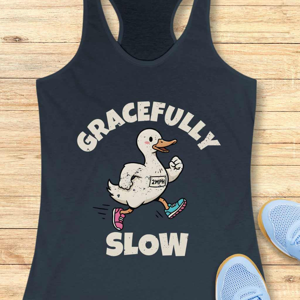 dark blue tank top with a running duck graphic and 'Gracefully Slow' text on a wooden surface.