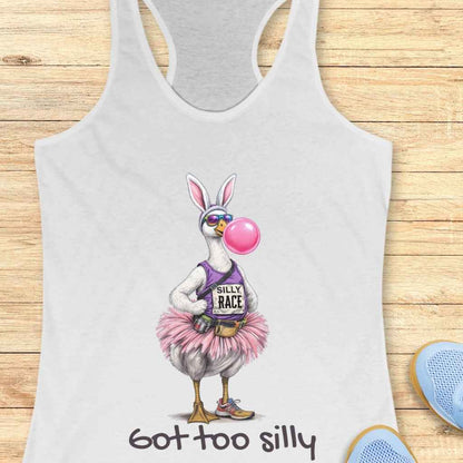 Digital illustration of a quirky goose wearing bunny ears, mirrored sunglasses, blowing a large pink bubble gum bubble, a purple 'Silly Race' tank top, fluffy pink tutu, fanny pack, and orange-accented running shoes, appearing on a white tank top above the phrase 'got too silly'