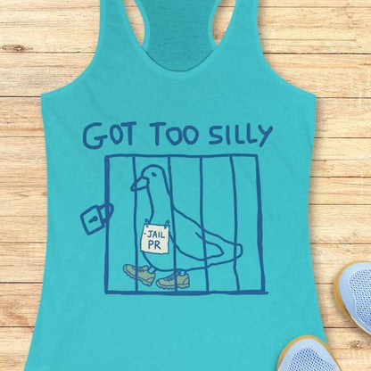 Printed design on a turquoise tank top depicting a cartoon pigeon wearing green running shoes and holding a 'JAIL PR' sign inside a blue cage, with the text 'GOT TOO SILLY' above, and two partially visible light blue mesh sneakers at the bottom right