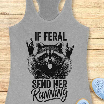 Gray tank top with a raccoon graphic and text on a wooden surface