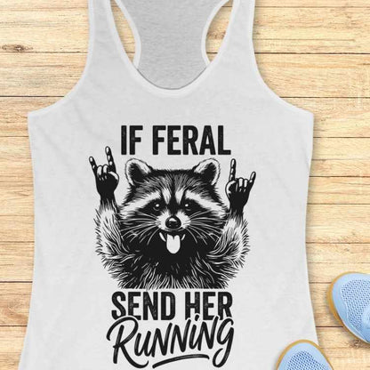 white tank top with a raccoon graphic and text on a wooden surface