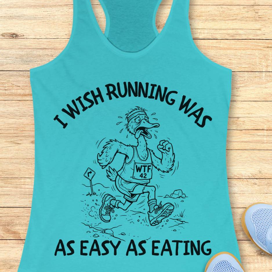 Turquoise tank top with graphic and text on a wooden surface