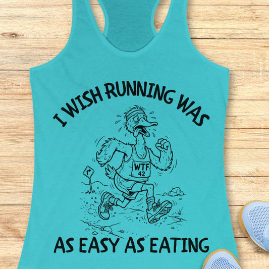 Turquoise tank top with graphic and text on a wooden surface