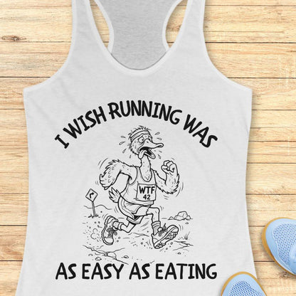 white tank top with a graphic and text on a wooden surface