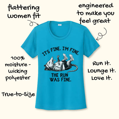blue performance t-shirt with possum image and text 'It's fine. I'm fine. The run was fine.'  on a wooden surface with sneakers.