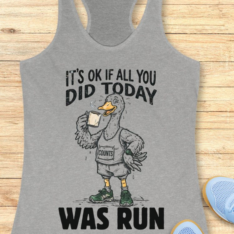 Heather grey tank top with a graphic of a duck and text "it's ok if all you did today was run" on a wooden surface