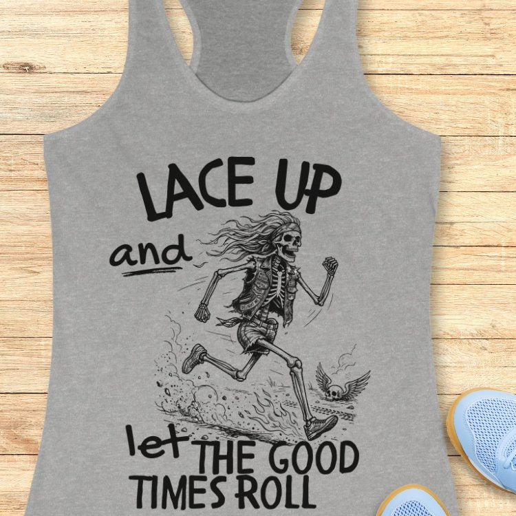 Gray tank top with skeleton design and text Lace up and let the good times roll' on a wooden surface