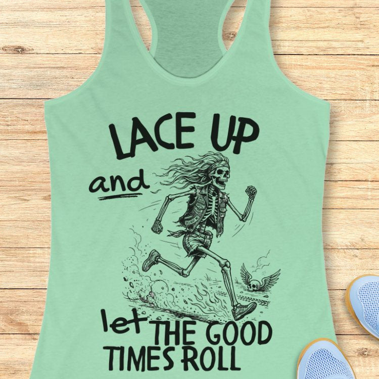 Mint green tank top with skeleton design and text Lace up and let the good times roll' on a wooden surface