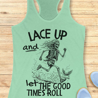 Mint green tank top with skeleton design and text Lace up and let the good times roll' on a wooden surface