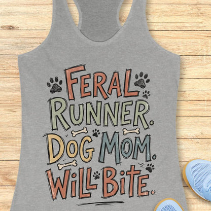 Gray tank top with 'Feral Runner. Dog Mom. Will Bite.' text on a wooden surface