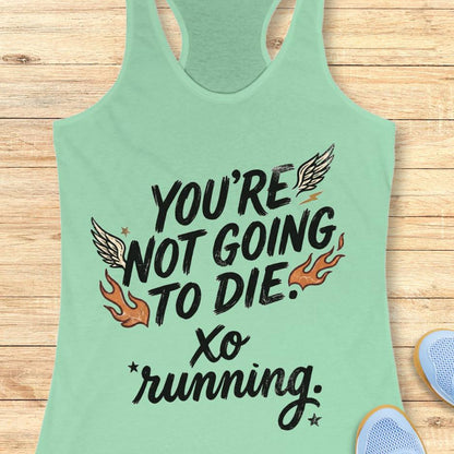 Mint green tank top with motivational quote "You're not going to die. XO running."  on a wooden surface