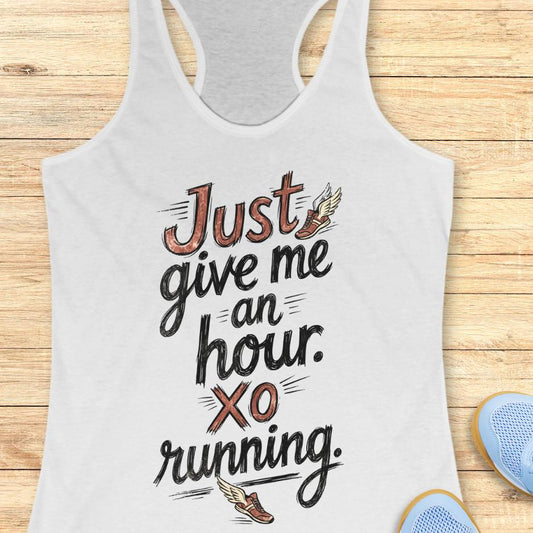 White tank top with motivational text "just give me an hour. xo running." on a wooden surface