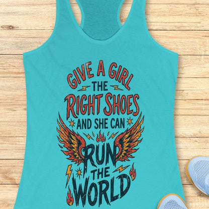 blue tank top with motivational quote "give a girl the right shoes and she can run the world" on a wooden surface