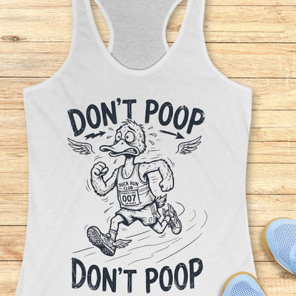 white tank top with a graphic of a duck running and text 'Don't Poop' on a wooden surface.